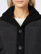 Woman  padded jacket with knitted sleeves