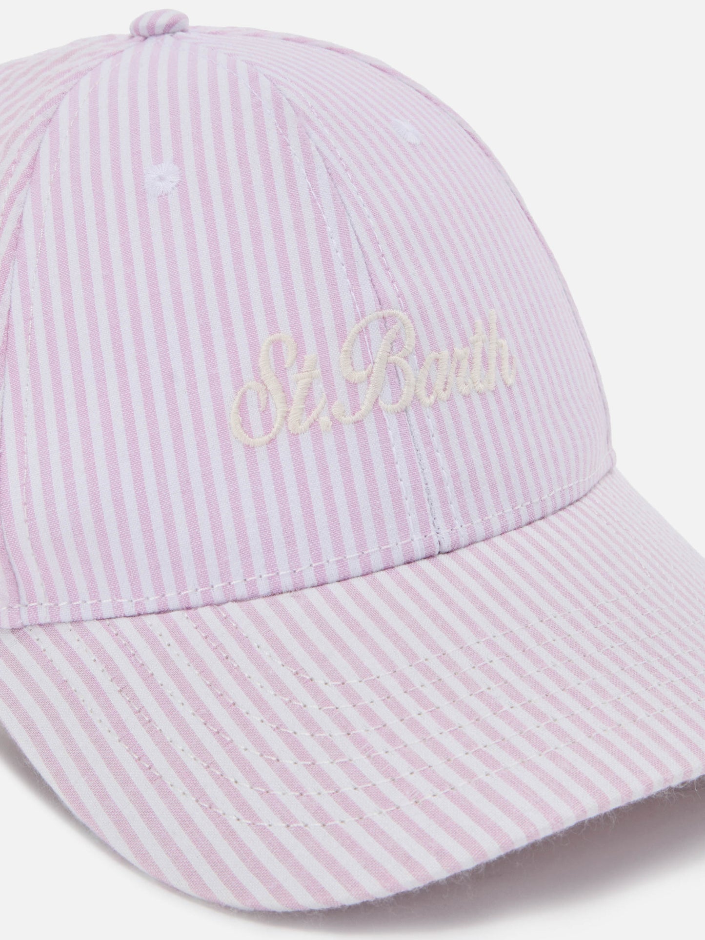 Baseball cap with visor in cotton seersucker with pink and white stripes