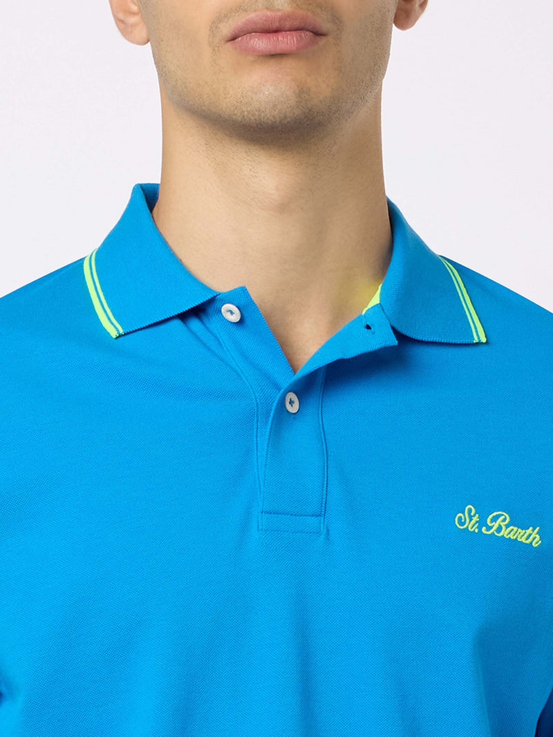 Herren-Poloshirt Beverly Hills aus blauem Baumwoll-Piqué mit Palmenstickerei