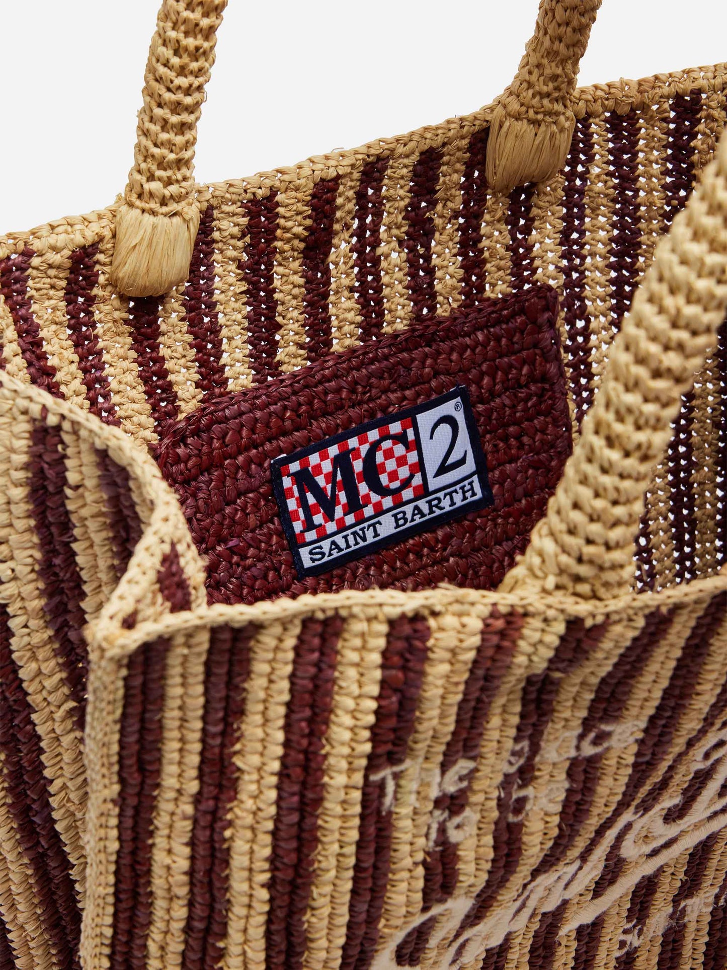 Gestreifte Colette-Tasche aus Raffia mit gesticktem Logo und Quaste 