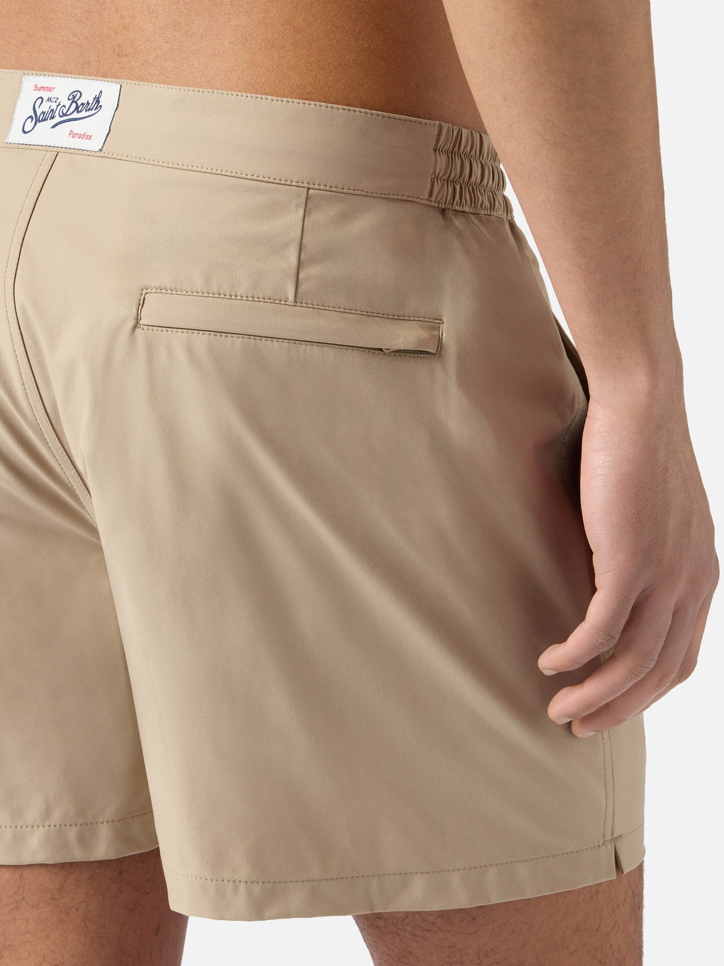 Capferrat swim shorts in solid beige with embroidered logo