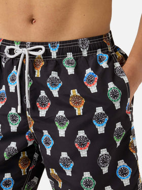 Gustavia swim shorts in solid black with watch print