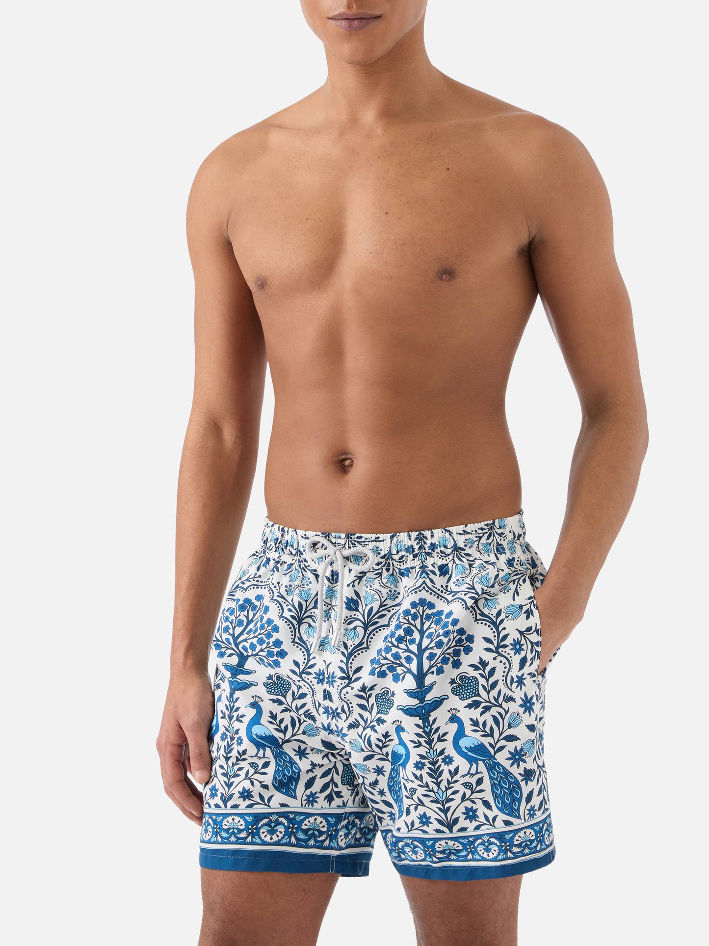 Gustavia white swim shorts with contrasting peacock print