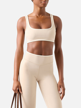 Top fitness Kassie beige con ribetes en contraste 
