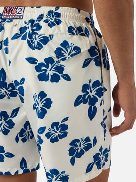 White Lighting swim shorts with all-over hibiscus print