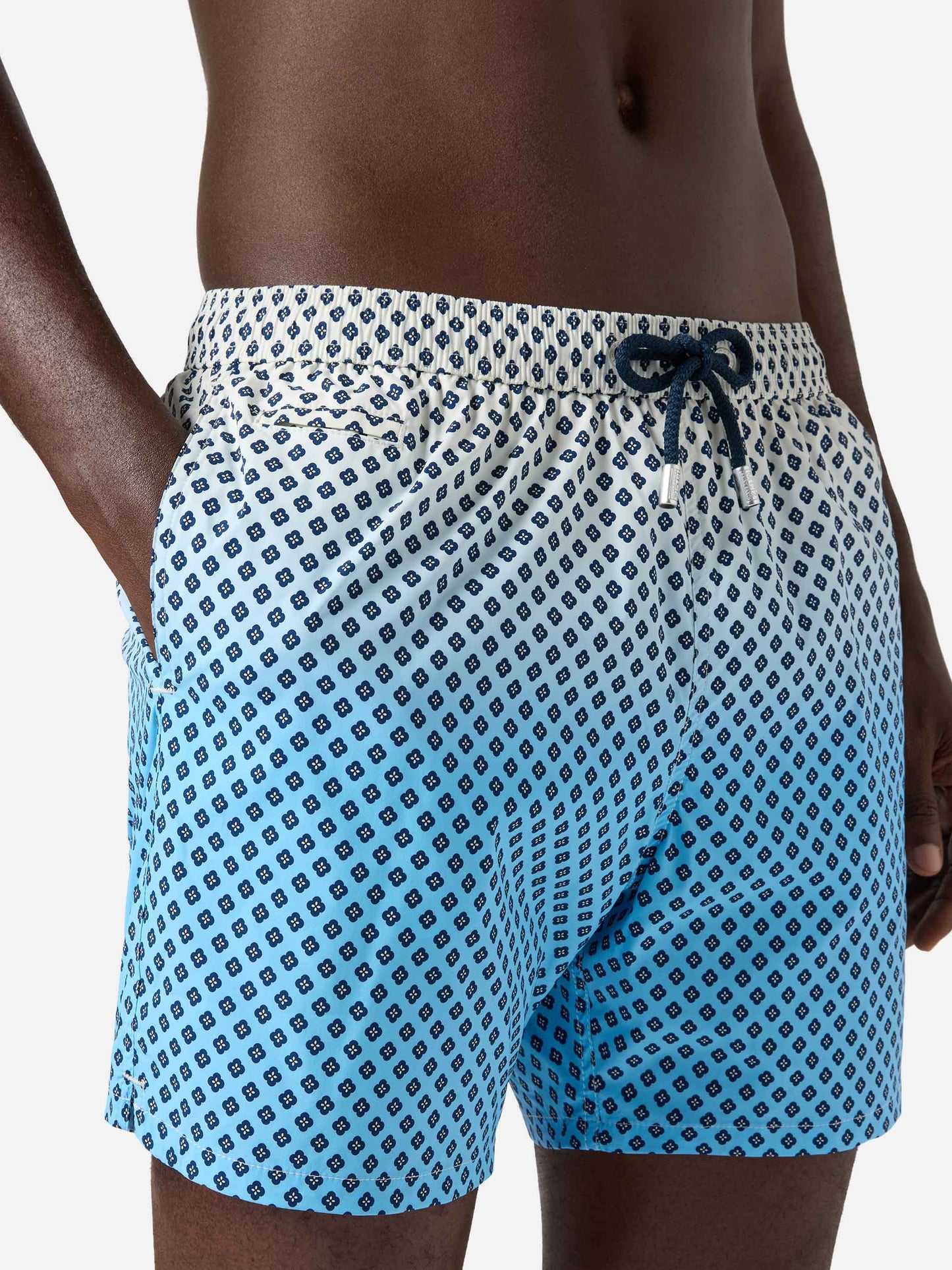 Lighting Micro swim shorts with geometric print on shaded background