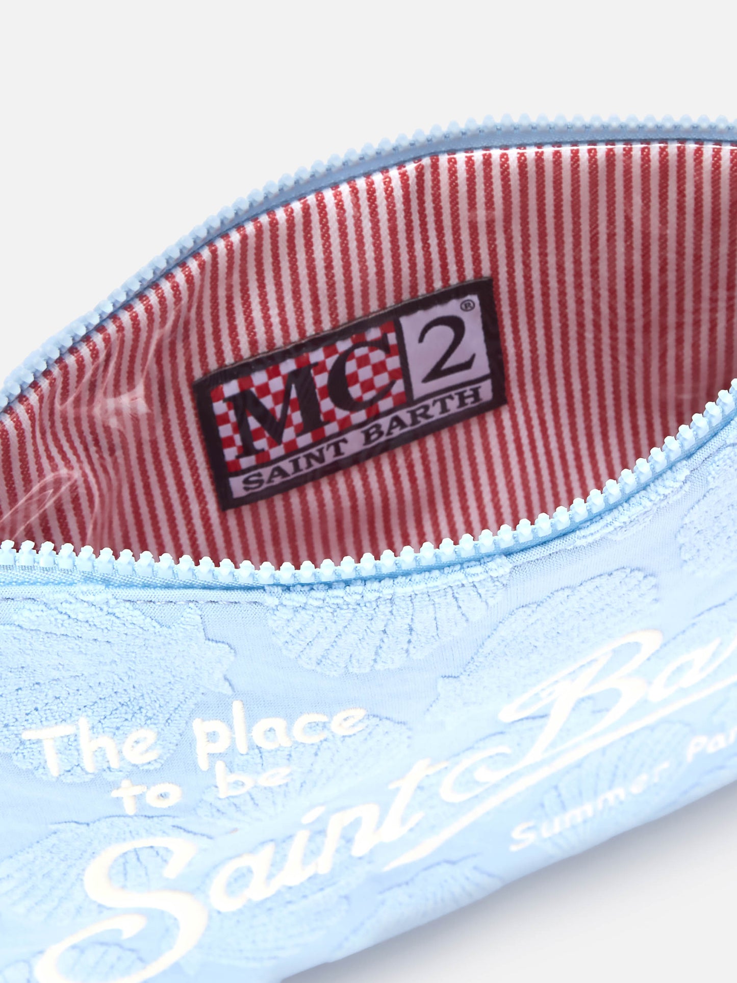 Parisienne Sponge terry-effect pouch with embossed shell pattern and removable strap