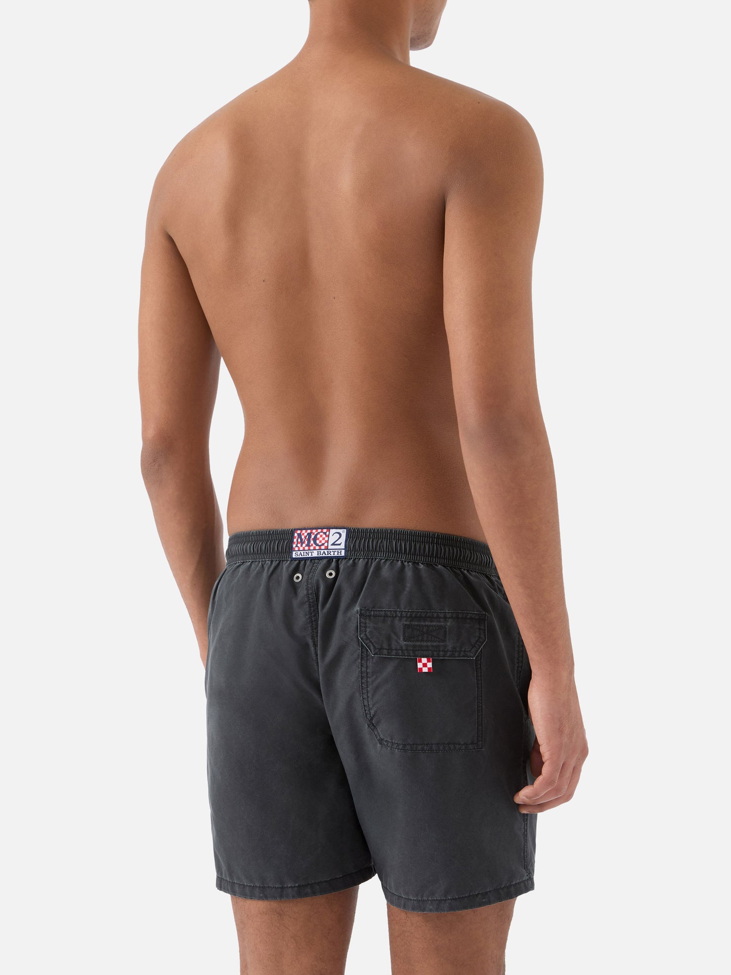 Patmos swim shorts in black with used effect and logo embroidery