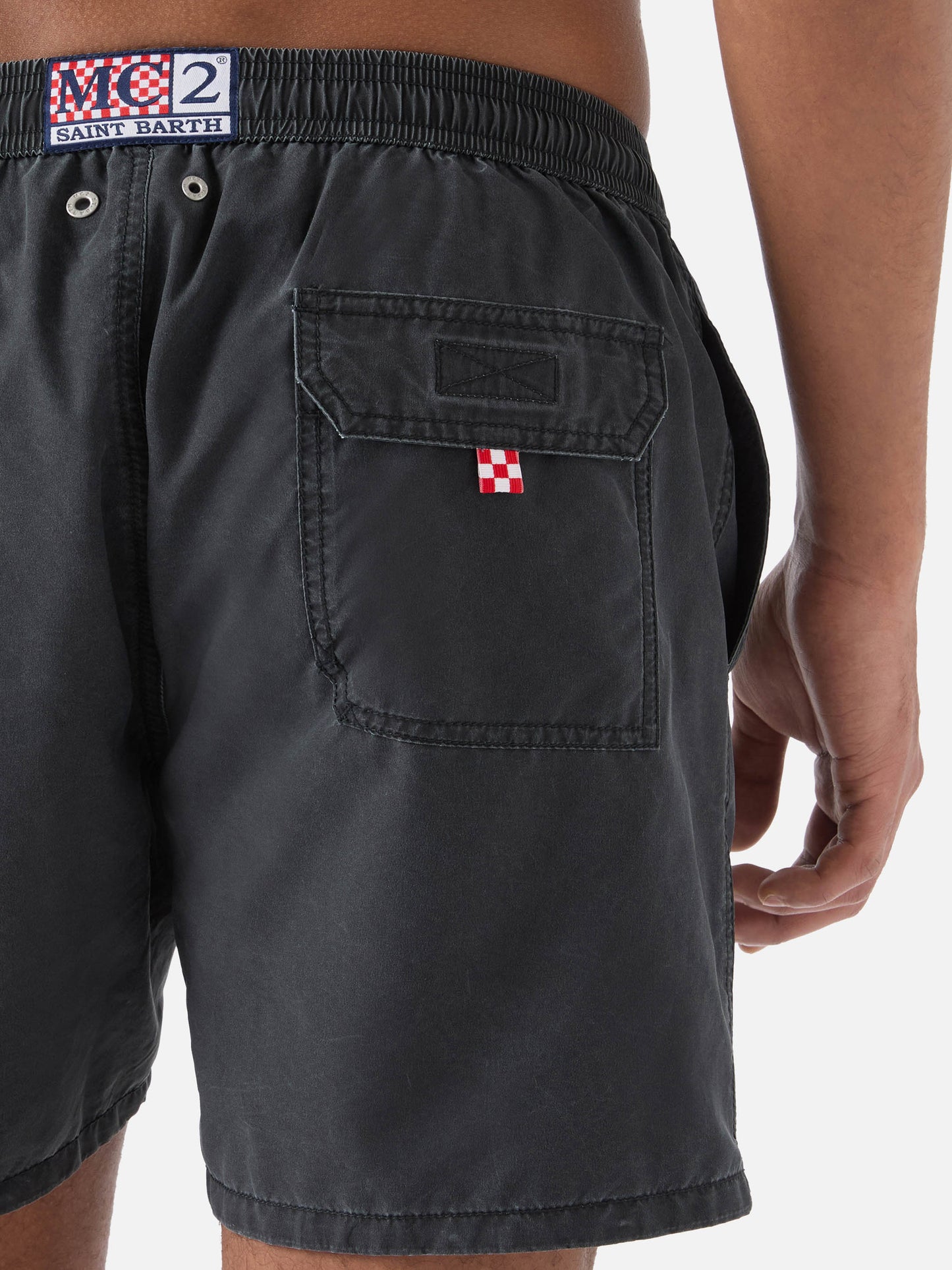 Patmos swim shorts in black with used effect and logo embroidery