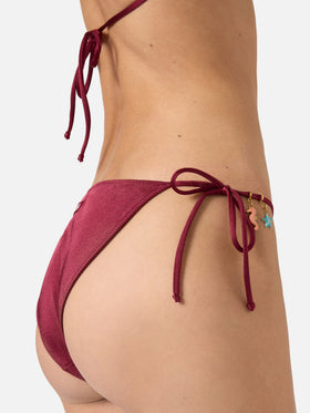 Virgo classic bikini bottoms in burgundy glossy-finish fabric with charm details