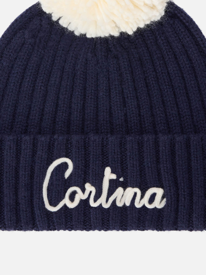 Navy blue Wengen beanie with pompom and Cortina embroidery