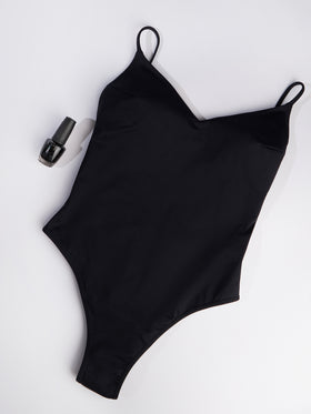 Woman black one piece swimsuit