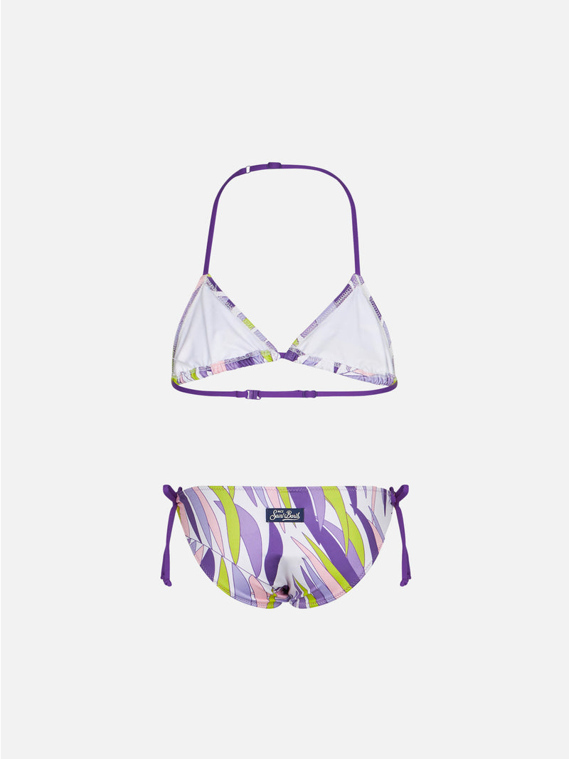 Girl triangle bikini with palms leaves