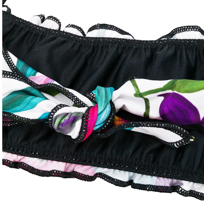 Girl bandeau bikini with tropical leaves