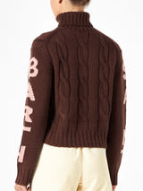 Woman brown turtleneck braided sweater